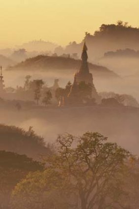 Pagodas peek through early-morning fog at Bagan.