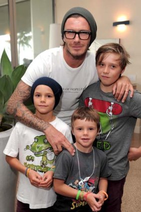 David Beckham with sons (from left) Romeo, Cruz and Brooklyn late last year.