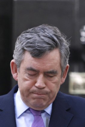 Uncertain times... a solemn but defiant Prime Minister Gordon Brown.