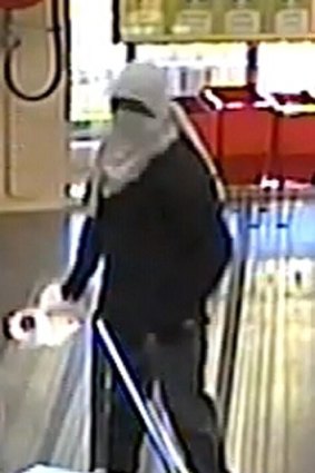 CCTV picture of the robbery at a Bentley liquor store.