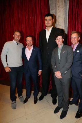 Former Chinese basketball player Yao Ming (centre) poses for a photograph with (left to right) Dustin Johnson of the US, Graeme McDowell and Rory McIlroy of Northern Ireland, and Luke Donald of England at a reception prior to the WGC-HSBC Champions world golf championship in Shanghai.