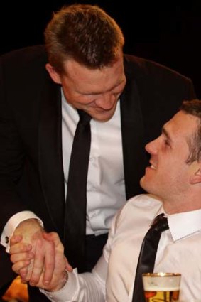 Happy Pies: Nathan Buckley congratulates Dane Swan at the 2011 Brownlow Medal count.