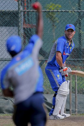 Murali works with David Warner in the nets.