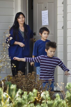 Mayumi Heene with two of her three boys, Falcon (centre), 6, and Ryo (right), 8, leave their home.