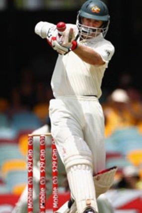 On the ball ... opener Simon Katich hooks on his way to 92 at the Gabba yesterday.