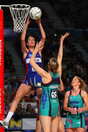 Anna Harrison of the Mystics blocks the shot of Karyn Howarth of the Vixens during the round eight of the ANZ Championship.