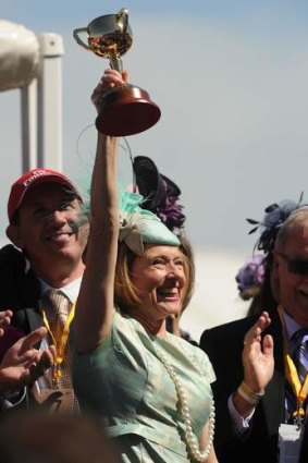Trainer Gai Waterhouse holds the 2013 Melbourne Cup after Fiorente's victory.