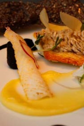 The one dish you must try ... Crispy scaled snapper, smoked potato puree, calamari crackling, ink sauce, $34.