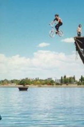 Teenagers experience the thrill of the Birdman Rally launch platform on Lake Burley Griffin after competition finish in 1987.