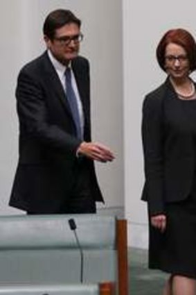 The day after … Julia Gillard enters the House of Representatives as a backbencher on June 27, flanked by supporters (from left) Greg Combet, Wayne Swan and Craig Emerson.