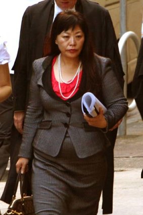 Helen Liu enters the court yesterday.