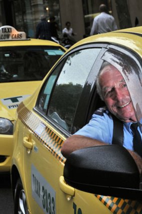 Andy Tsionis drives his cab in Melbourne's CBD.