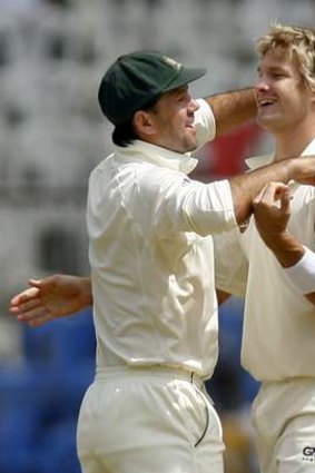 Mutual admiration: Ricky Ponting (left) and Shane Watson celebrate a wicket.