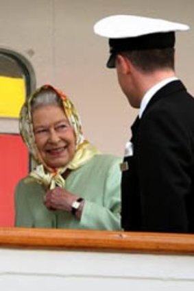 Britain's Queen Elizabeth II talks with Captain Michael Hepburn, after boarding the yacht 'Hebridean Princess' in Stornoway, Scotland.