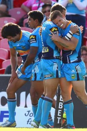 Strong start: Steve Michaels of the Titans celebrates his try in what was Gold Coast's third win in four matches.