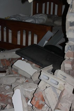 A woman was asleep in a bedroom when a car crashed through in Dandenong North.