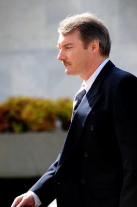 Letter bomber Colin Dunstan leaves the Supreme Court in Canberra, 2010. He is accusing Comcare of defying a court order and withholding cash that is rightfully his.