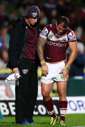 Anthony Watmough is assisted from the field.