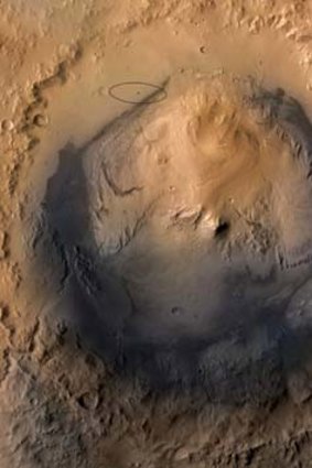 The target landing area for NASA's Mars Science Laboratory mission is the ellipse marked on this image of Gale Crater on Mars (top left).