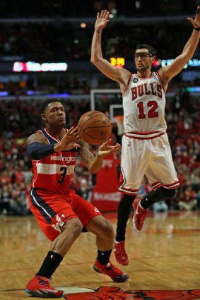 Smooth moves: Bradley Beal (left) scored a game-high 26 points against Chicago.