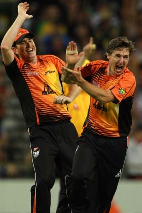 Brad Hogg of the Scorchers celebrates dismissing Cameron Borgas of the Strikers.