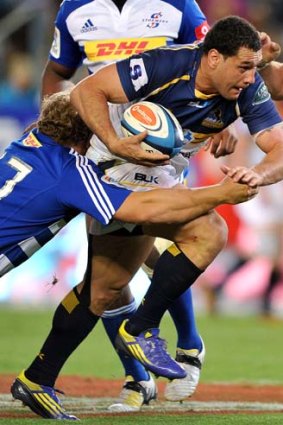 On the rampage: George Smith of the Brumbies.