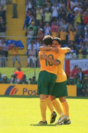 Harry Kewell congratulates Tim Cahill on scoring his first goal in the game against Japan during the 2006 World Cup in Germany.