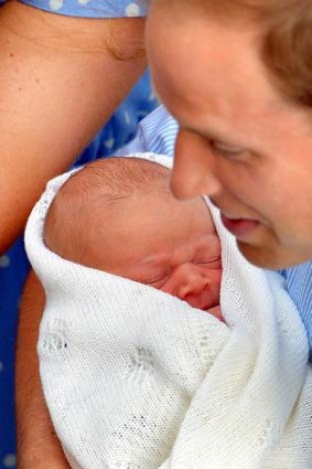 Involved: Prince William holds his newborn son.