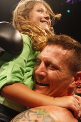 Danny Green celebrates his stunning win with daughter Chloe.
