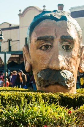 The giant papier mâché head of Henry Lawson on display in Grenfell.