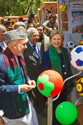 Afgan President Hamid Karzai and US Secretary of State Hillary Clinton  tour a crafts baazar in Kabul, where they are attending the International Conference on Afghanistan.