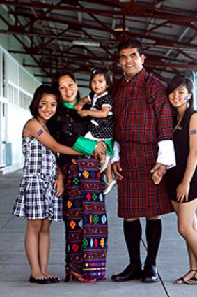 The Sharma Luital family dressed in  Bhutanese costume for a citizenship ceremony at Station Pier.