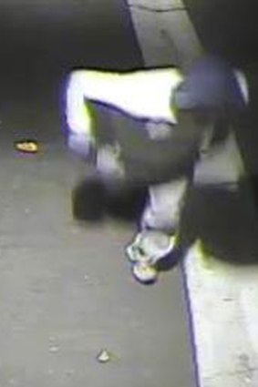 A security camera image of a man running after a pizza store in Brunswick East was fired on.