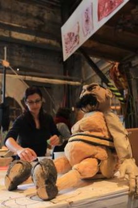 Erth puppeteers Katrina Lynch, left, and Aesha Henderson prepare for Murder at Carriageworks.