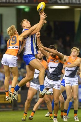 Spoiler: Nick Haynes attempts to stop big Roo Drew Petrie taking a mark.