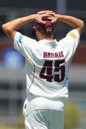 Slowed down: Ryan Harris, bowled over by a virus, field in slips.