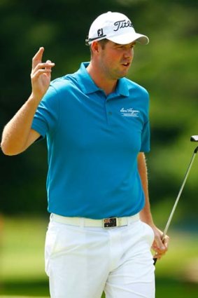 Marc Leishman acknowledges the crowd after sinking a putt during the first round of the 2013 Travelers Championship at TPC River Highlands in Connecticut.