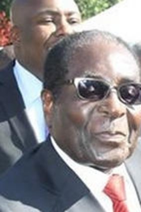 Psychology Maziwisa with  Zimbabwean President Robert Mugabe.
