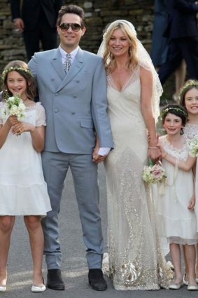 Kate Moss says she is terrible at posing for snapshots - and even found her wedding photos unnatural.