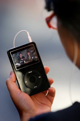 A viewer watches video on an iPod.