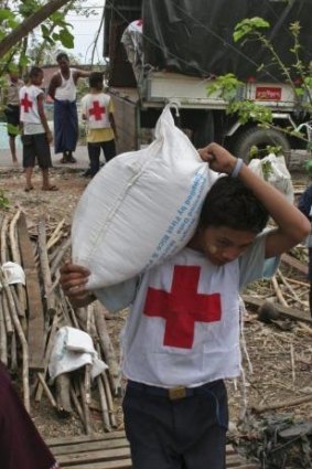 Myanmar Red Cross workers unload emergency food donations.