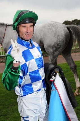 Jockey Glen Boss gives the victory sign after his win on Puissance De Lune on Saturday.