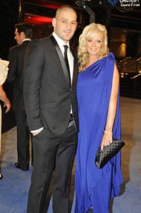 Before the booze-up ... Brendan Fevola and wife Alex at the classier end of the evening.