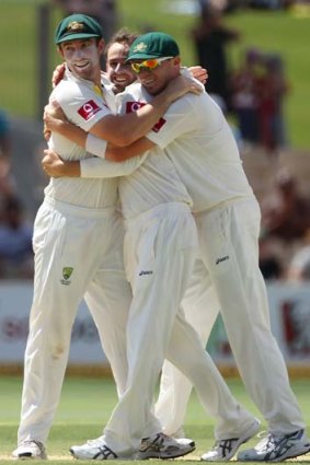 Whitewash: (From left) Shaun Marsh, Nathan Lyon and Peter Siddle celebrate as Lyon takes the last Indian wicket.