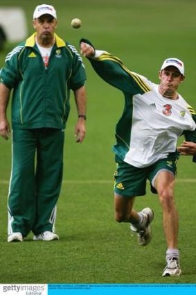 In a 'former' life, Mike Young checks Mike Hussey's throwing arm.