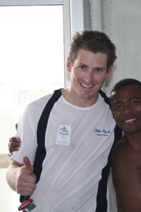 Ward gets the thumbs up from a Mongolian swimmer at the Beijing Paralympics.