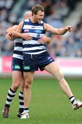 Cameron Mooney celebrates one of his five goals during Geelong's rout of Melbourne.
