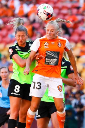 Liana Damasks (left) of Canberra United and Tameka Butt of the Roar head the ball.