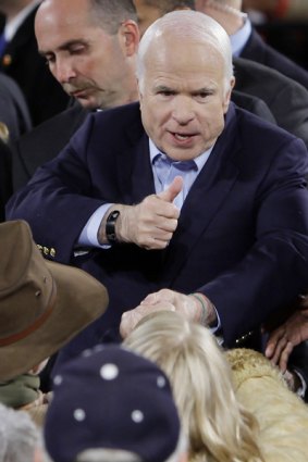 John McCain greets supporters at the midnight rally in Prescott.