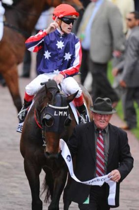 Southern Speed and Craig Williams are escorted to the mounting yard.